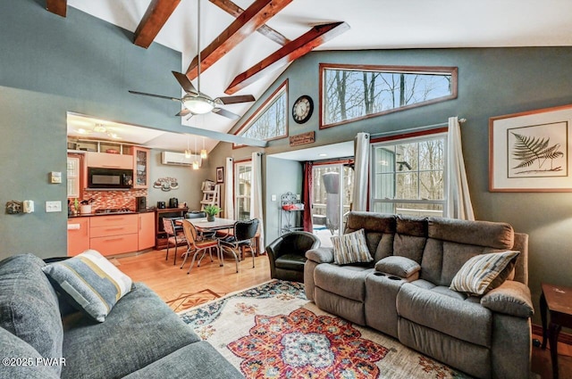 living room with wood-type flooring, high vaulted ceiling, a wall unit AC, beamed ceiling, and ceiling fan