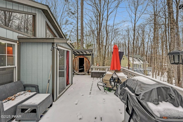 snow covered patio featuring area for grilling