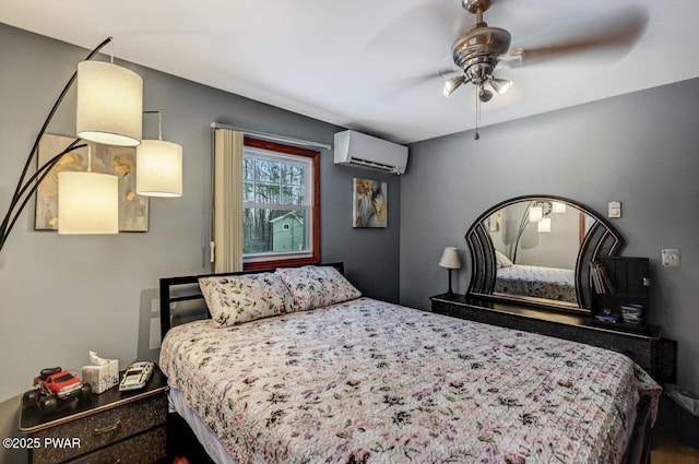 bedroom with ceiling fan and a wall unit AC