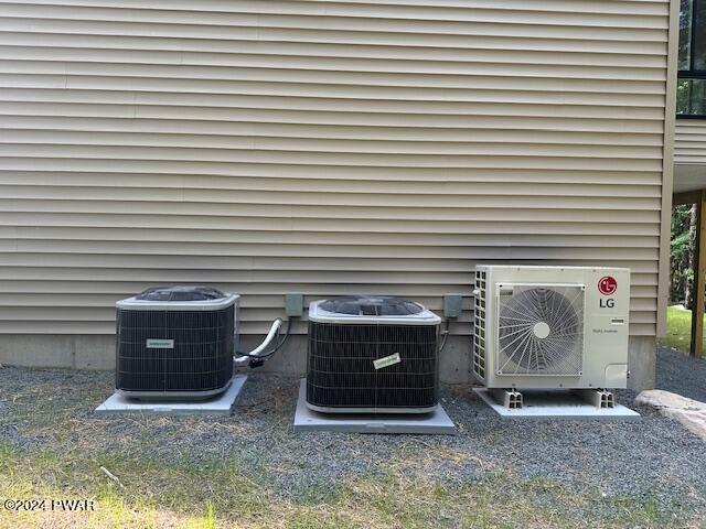 exterior details featuring ac unit and cooling unit