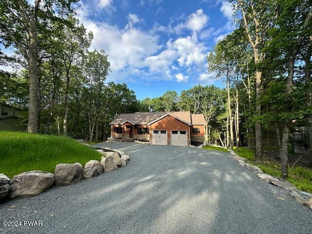 ranch-style house featuring a garage