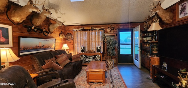 145 Father John Dr, Lake Ariel, PA 18436 - living room featuring wood walls, vaulted ceiling, wood finished floors, and a textured ceiling