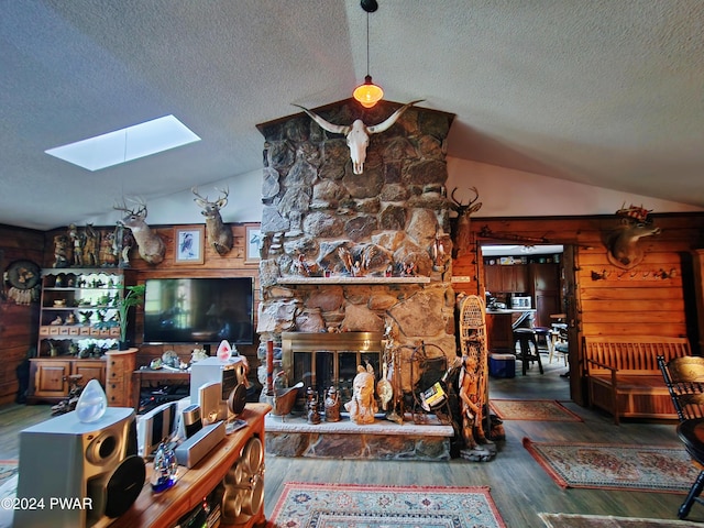 145 Father John Dr, Lake Ariel, PA 18436 - living room with vaulted ceiling, a skylight, a textured ceiling, and wood finished floors