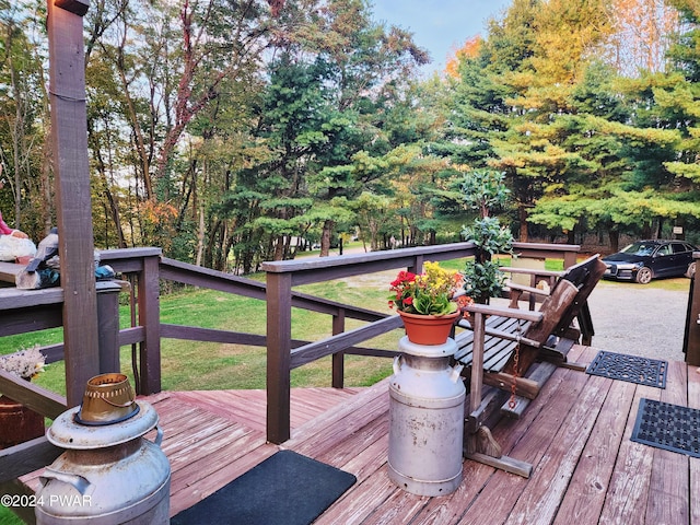 wooden terrace with a yard