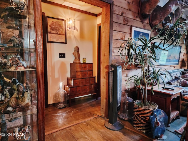 corridor featuring wooden walls and wood-type flooring