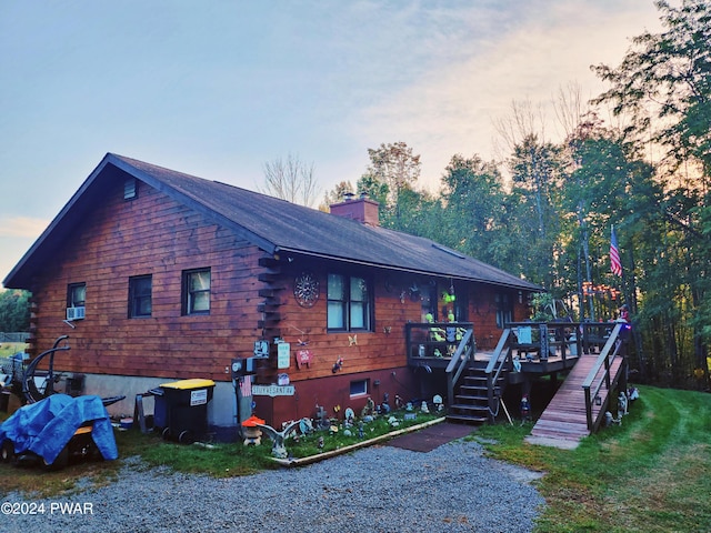 145 Father John Dr, Lake Ariel, PA 18436 - property exterior at dusk with a wooden deck, a chimney, and stairway