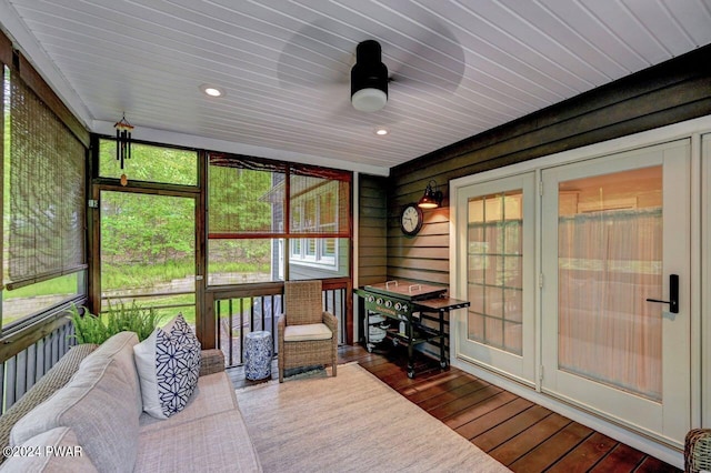 sunroom / solarium featuring radiator