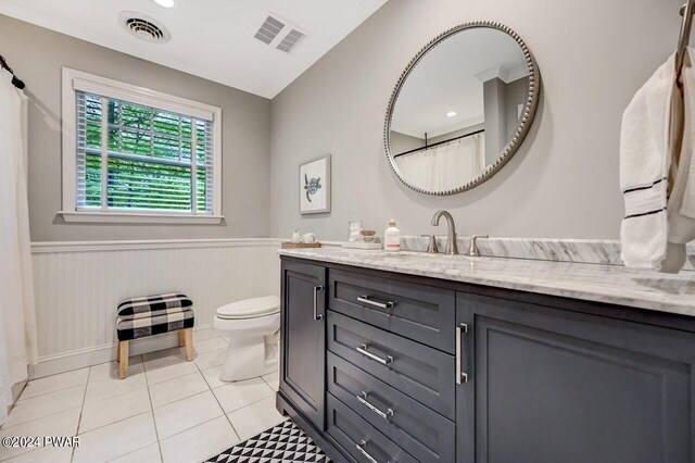 bathroom with wood walls, tile patterned flooring, vanity, and toilet