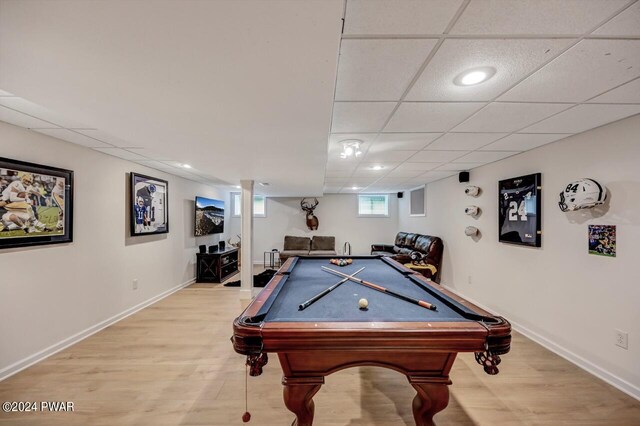 playroom with light hardwood / wood-style floors and billiards