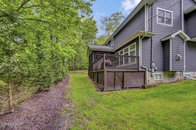 view of yard with a wooden deck