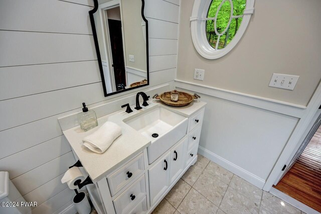 bathroom featuring tile patterned flooring and vanity