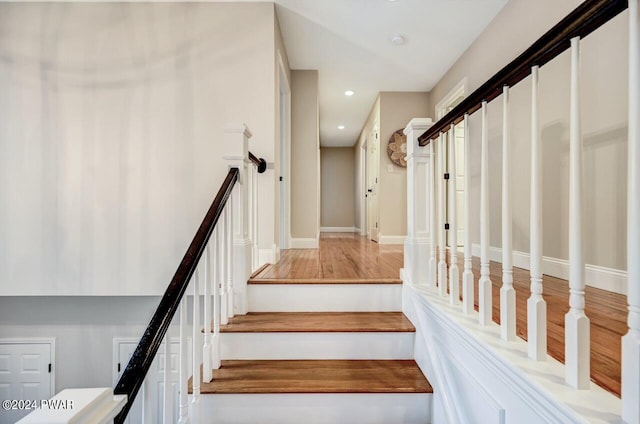 stairs with wood-type flooring