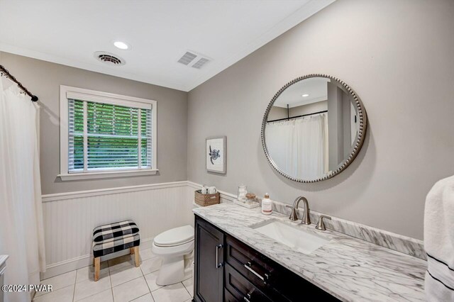 bathroom with tile patterned floors, vanity, and toilet