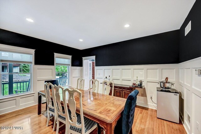 dining space with light hardwood / wood-style floors