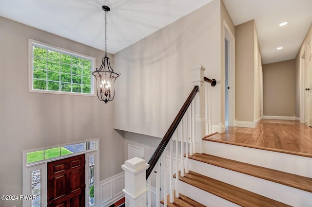 foyer with an inviting chandelier