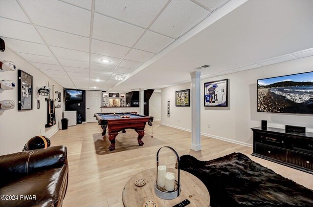 game room featuring a drop ceiling, pool table, and light hardwood / wood-style flooring