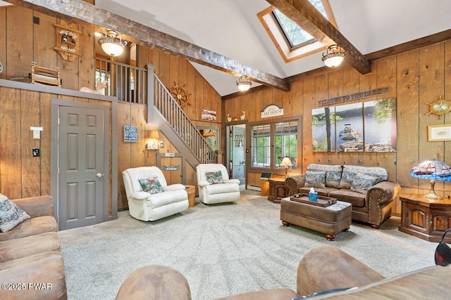 88 Paupack Point Rd, Hawley, PA 18428 - carpeted living area featuring wooden walls, high vaulted ceiling, a skylight, beamed ceiling, and stairway