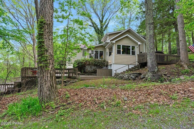88 Paupack Point Rd, Hawley, PA 18428 - back of house featuring stairway and a deck