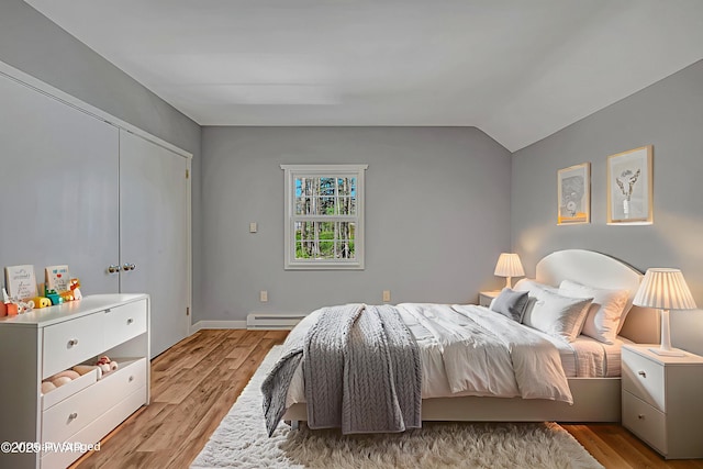 133 Neil Thompson Rd, Lackawaxen, PA 18435 - bedroom featuring light wood finished floors, lofted ceiling, and a baseboard radiator