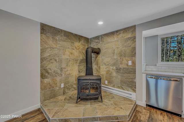133 Neil Thompson Rd, Lackawaxen, PA 18435 - detailed view of dishwasher, a wood stove, and recessed lighting