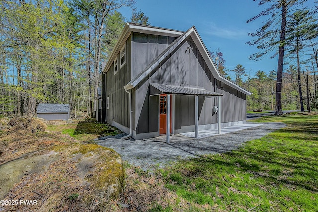 133 Neil Thompson Rd, Lackawaxen, PA 18435 - back of house with a patio area and board and batten siding