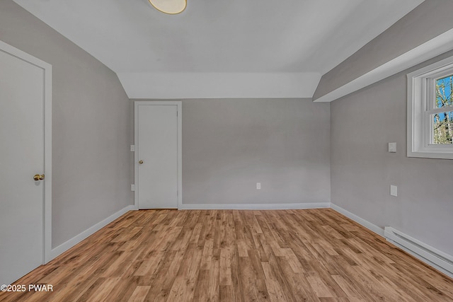 133 Neil Thompson Rd, Lackawaxen, PA 18435 - additional living space with baseboard heating, vaulted ceiling, and wood finished floors