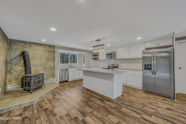 133 Neil Thompson Rd, Lackawaxen, PA 18435 - kitchen featuring stainless steel appliances, dark wood-style floors, light countertops, recessed lighting, and white cabinetry