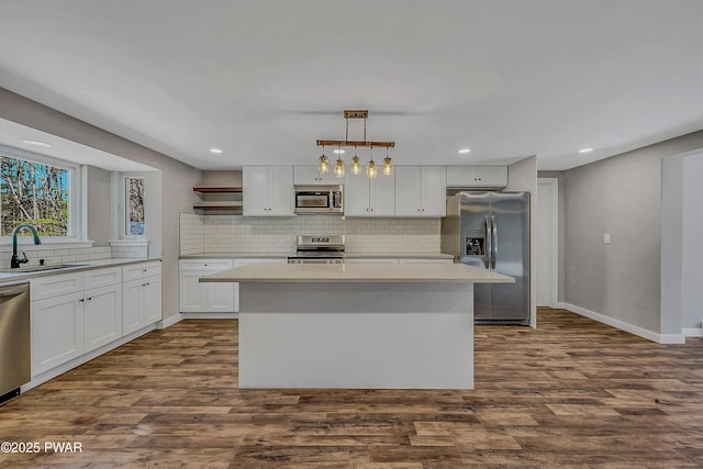 133 Neil Thompson Rd, Lackawaxen, PA 18435 - kitchen with appliances with stainless steel finishes, backsplash, open shelves, dark wood finished floors, and recessed lighting
