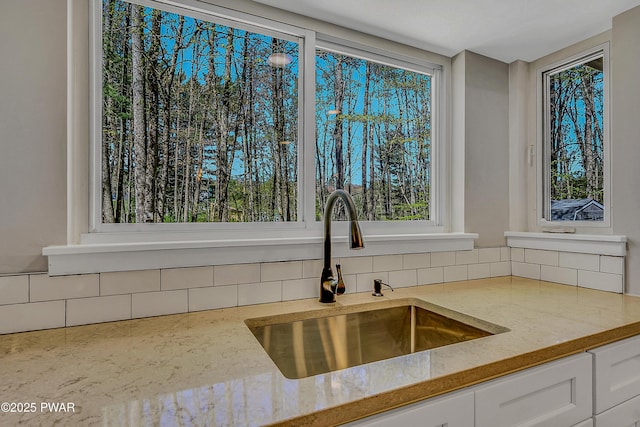 133 Neil Thompson Rd, Lackawaxen, PA 18435 - kitchen featuring backsplash, white cabinets, and light stone counters