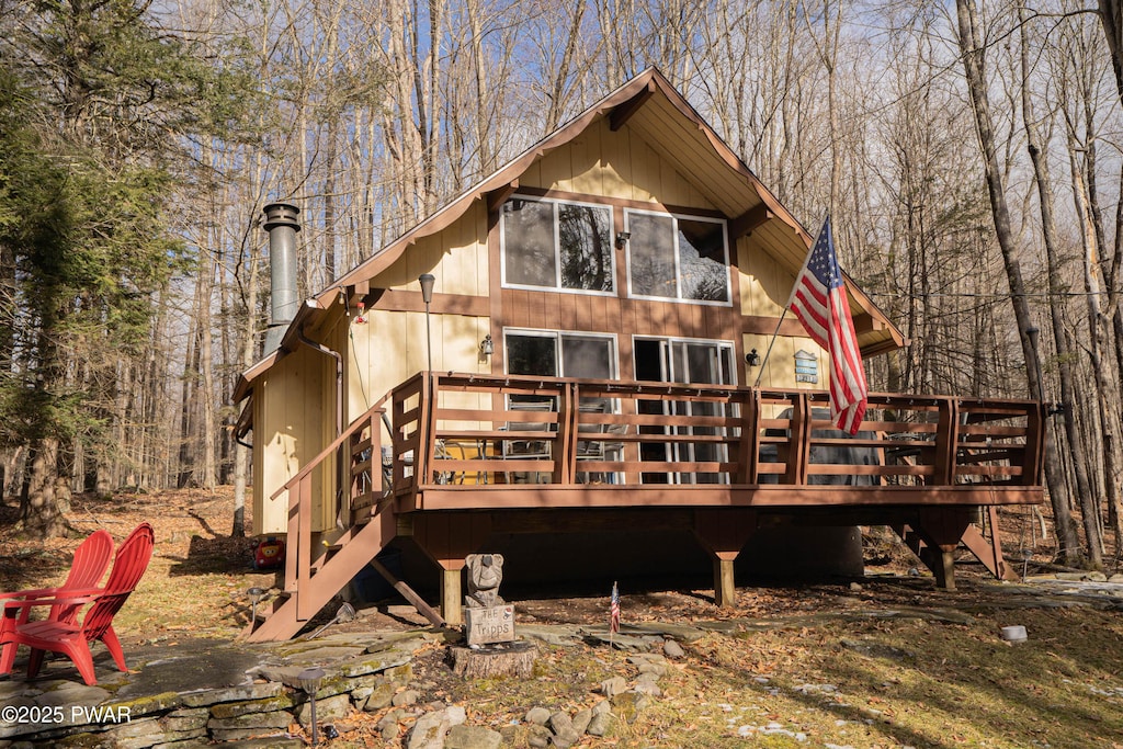 back of house with a wooden deck