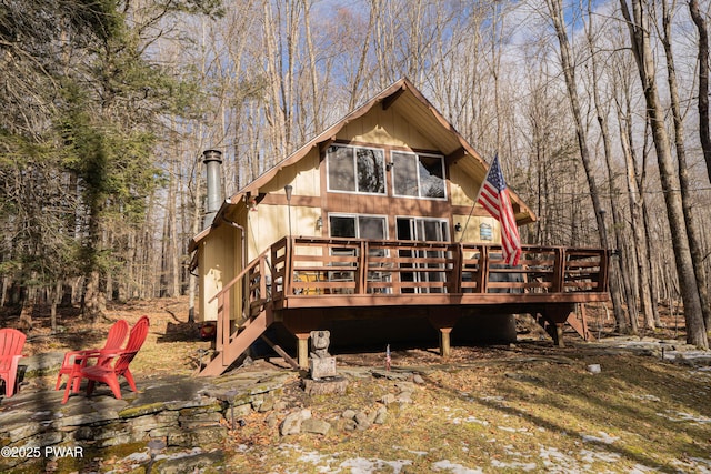 back of house featuring a wooden deck