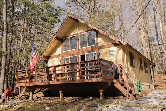 back of house featuring a wooden deck