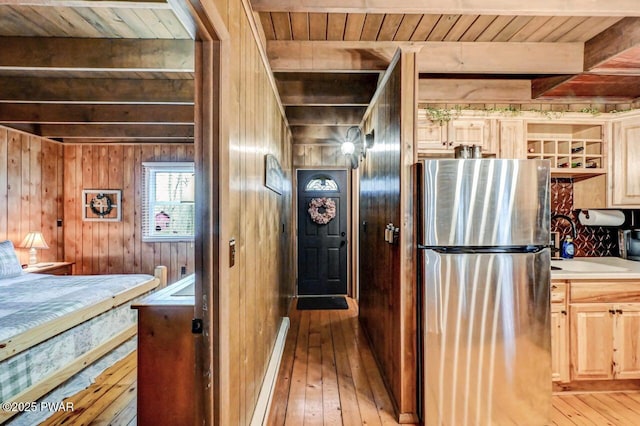 252 Upper Independence Dr, Lackawaxen, PA 18435 - kitchen featuring light brown cabinets, light wood-style flooring, freestanding refrigerator, wood ceiling, and a sink