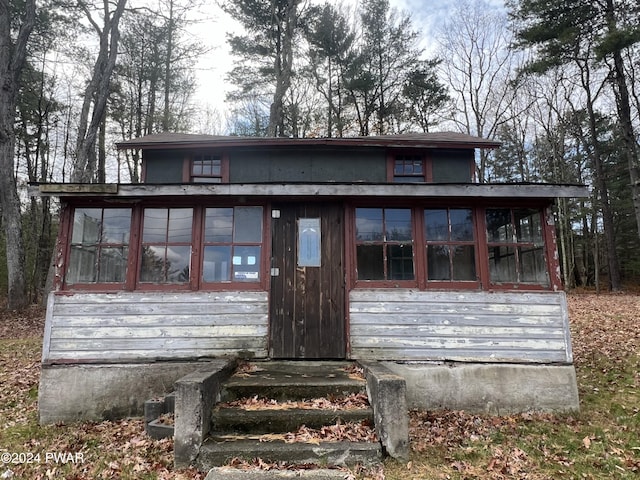 view of front facade featuring a sunroom