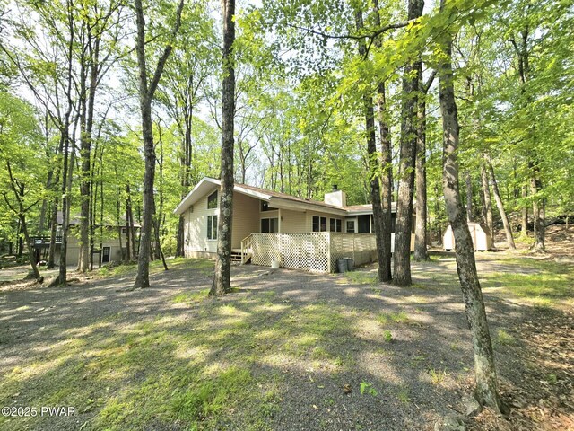 113 Widgeon Ln, Lords Valley, PA 18428 - view of side of home featuring a chimney and a wooden deck
