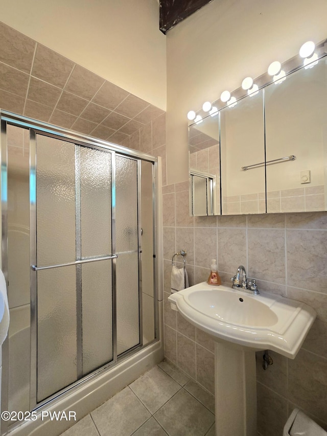 113 Widgeon Ln, Lords Valley, PA 18428 - bathroom featuring a shower stall, tile patterned floors, and tile walls