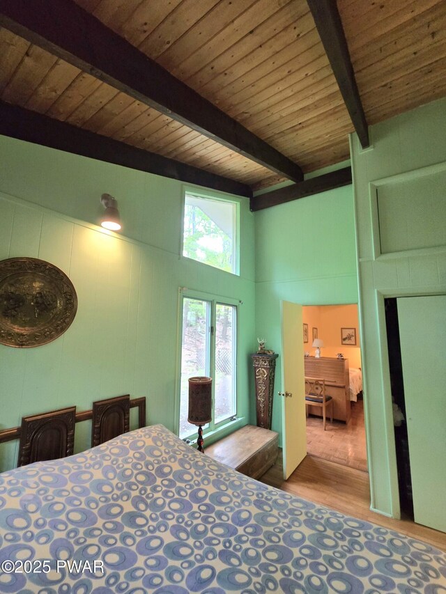 113 Widgeon Ln, Lords Valley, PA 18428 - bedroom featuring wood finished floors, wooden ceiling with exposed beams, and a towering ceiling