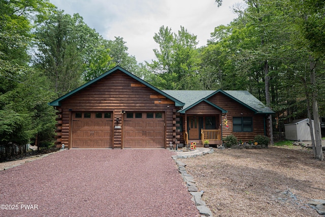 1010 Lotus Ter, Lake Ariel, PA 18436 - log-style house featuring log siding, driveway, an attached garage, and a storage shed