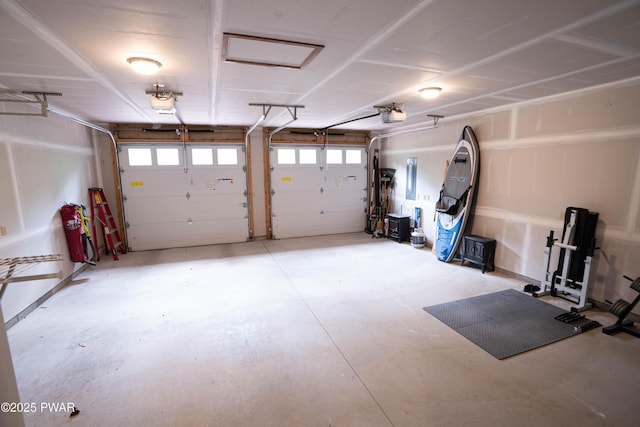 1010 Lotus Ter, Lake Ariel, PA 18436 - garage featuring electric panel and a garage door opener