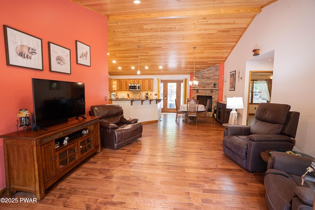 1010 Lotus Ter, Lake Ariel, PA 18436 - living room with light wood-style floors, a stone fireplace, wood ceiling, high vaulted ceiling, and recessed lighting