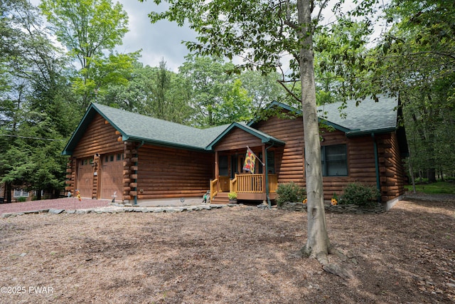 1010 Lotus Ter, Lake Ariel, PA 18436 - cabin with log siding, an attached garage, covered porch, and roof with shingles