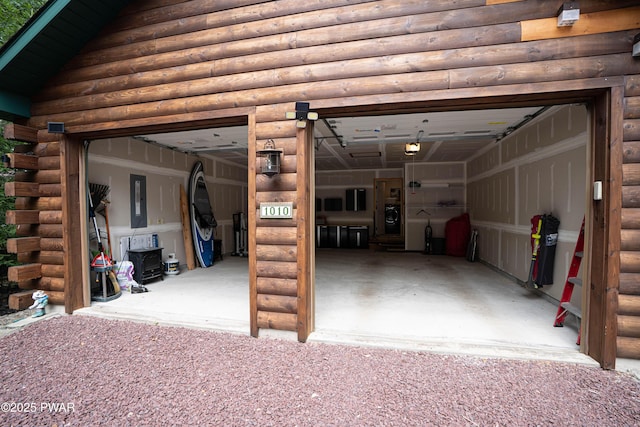 1010 Lotus Ter, Lake Ariel, PA 18436 - garage featuring electric panel and a garage door opener