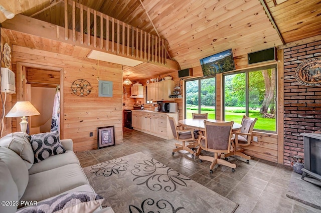 living room featuring wood walls, a towering ceiling, electric panel, and a wall mounted AC