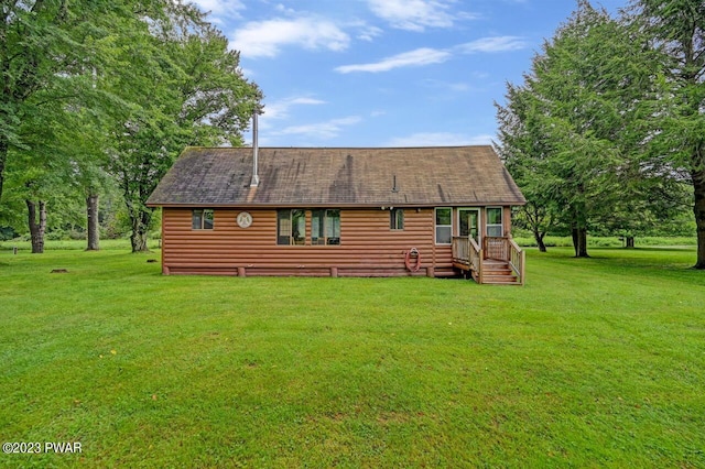 back of house with a yard