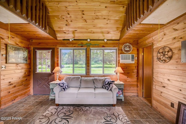 living room featuring high vaulted ceiling and wooden walls