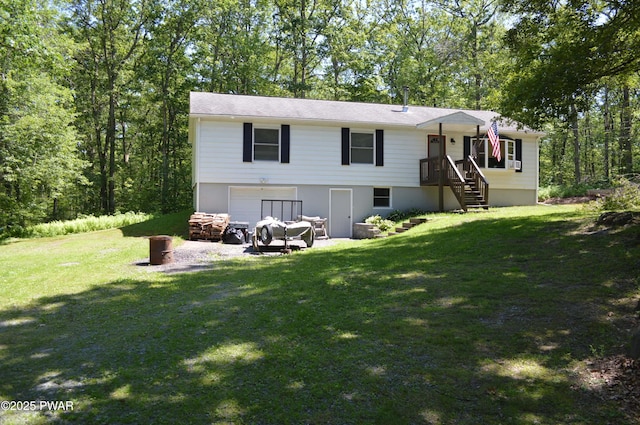 292 Well Rd, Greeley, PA 18425 - back of house with a lawn and a garage