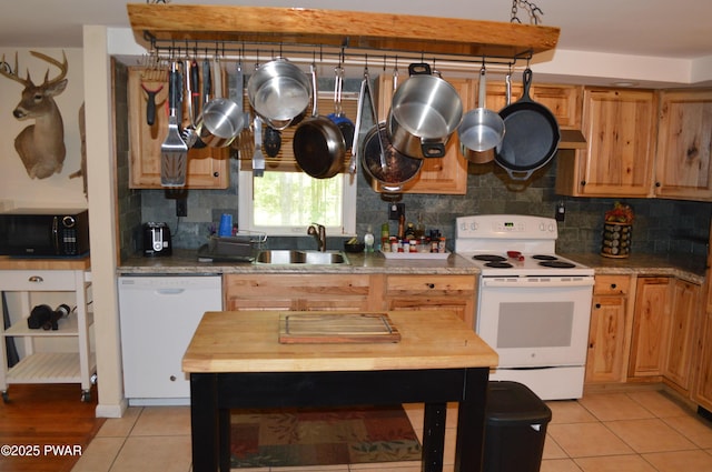 292 Well Rd, Greeley, PA 18425 - kitchen featuring white appliances, light tile patterned flooring, decorative backsplash, and light countertops