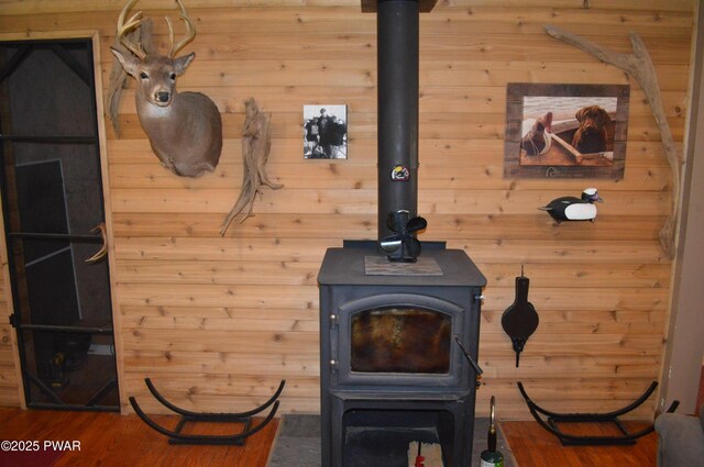 292 Well Rd, Greeley, PA 18425 - detailed view of a wood stove, wood finished floors, and wood walls