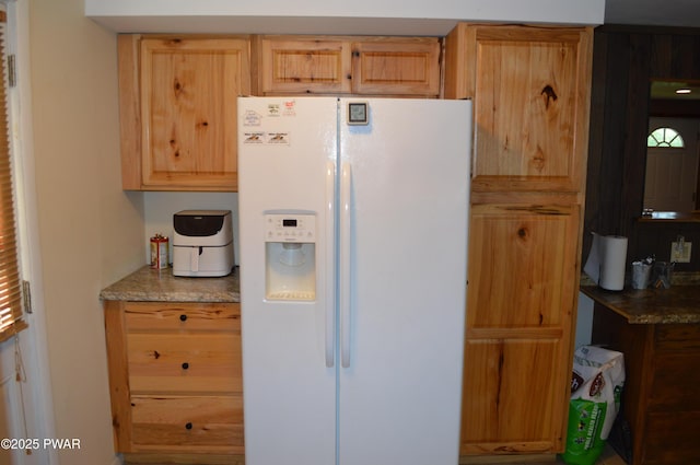 292 Well Rd, Greeley, PA 18425 - kitchen with white fridge with ice dispenser, light stone countertops, and light brown cabinets