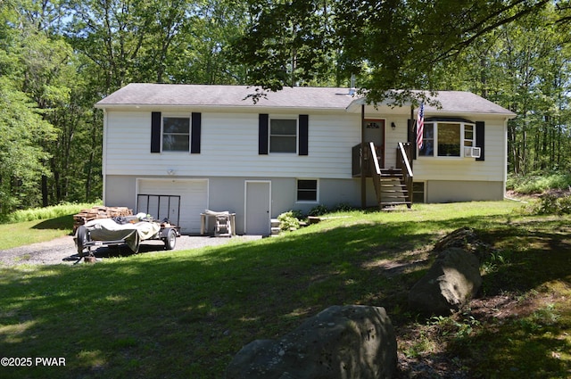 292 Well Rd, Greeley, PA 18425 - view of front facade featuring gravel driveway, a garage, and a front yard